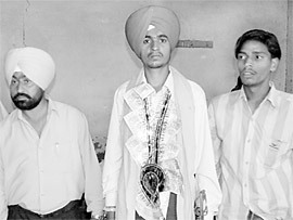 Karnail Singh and his relatives at a gurdwara after his bride refused to accompany him accusing him of being a drug addict, in Bathinda on Wednesday.