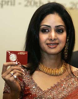 Bollywood actress Sridevi releases a gold coin at a press conference of the Karnataka Gold Festval in Bangalore on Thursday. The World Gold Council and the Art of Jewellery is organising the 40-day-long gold festival from April 10. 