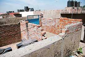 An illegal toilet structure on the top of flat no: 1107, Sector 39, Chandigarh, which has come up after the Chandigarh Housing Board carried out demolition of structures