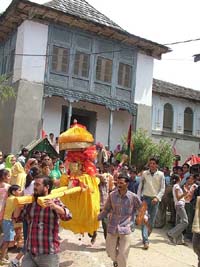 A hill god comes out of the palace of the royal family of earstwhile Suket Estate in Sundernagar on Thursday.