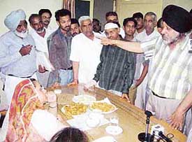 Manmohan Singh, a fruit and vegetable commission agent, pleads innocence before Ms Razia Sultana, MLA, Malerkotla, in Mandi Ahmedgarh. 