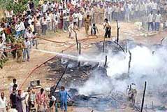 Firemen douse the flames at Colony No. 5 in Chandigarh on Friday. 
