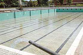 Watery blues: For that deep plunge to beat the heat of the summer of 2006, the Panjab University swimming pool being filled up in Chandigarh on Friday.