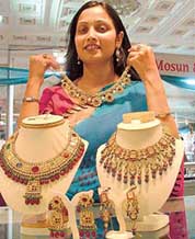 A visitor looks at precious necklaces at Wedding Style 2006 in Ludhiana on Friday.