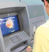 The SBI employees strike, which entered the fifth day, has rendered customers cashless. A customer tries his luck at the SBI ATM counter, but without any success in New Delhi