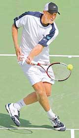Australian player Chris Guccione hits a volley on the way to defeating Max Mirnyi of Belarus in their Davis Cup quarterfinal tie being played in Melbourne on Friday. Guccioni won 7-6 (7/4), 3-6, 7-5, 3-6, 6-4. Australia lead 2-0.