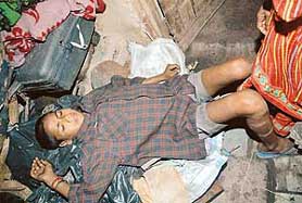 A slum-dweller sleeps in the open at Colony No. 5 in Chandigarh on Sunday.