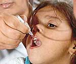 Polio drops being administered to children at Chandigarh Railway Station on Sunday. 