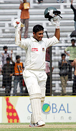 Bangladeshs Shahriar Nafees celebrates after completing his century on the first day of the first Test against Australia at Fatullah on Sunday
