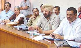 BJP national secretary Harjit Singh Grewal addresses a press conference along with other party leaders in Ludhiana