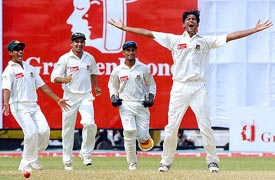 Bangladeshi bowler Shahadat Hossain celebrates with team-mates the dismissal of Australian captain Ricky Ponting during the second day of the first Test in Narayanganj on Monday