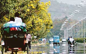 Hot air conditions create mirage on a road in Chandigarh on Tuesday