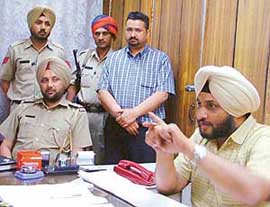 DSP Ravcharan Singh Brar gives details of the case of murder of a farmer, Harjinder Singh, at a press conference in Ludhiana on Tuesday.