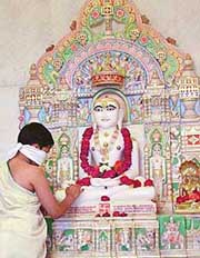 A young Jain devotee pays obiesance to Lord Mahavira on the occasion of Mahavir Jayanti in Ludhiana on Tuesday.