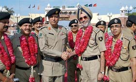 Mr N.P.S. Aulakh, Additional Director-General of the BSF, shakes hand with Col Tareeq Khan of the Pakistan Rangers at the Wagah border