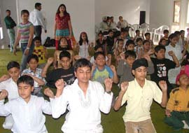 Children doing yoga during a workshop organised by the Art of Living in Amritsar.