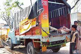 Harsh Kumar sells liquor from a mini-truck parked on the busy Panchkula-Naraingarh highway.