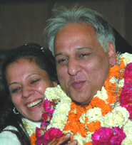 Newly-elected Mayor Farhad Suri being greeted by his wife in the Capital on Wednesday. 