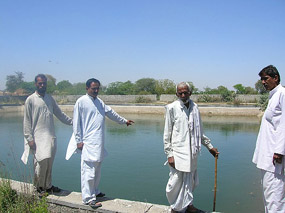 The sarpanch and villagers show the faulty tank at the waterworks of Ramayan village, near Hisar, on Wednesday.