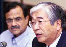Chairman of Maruti Udyog Ltd S. Nakanishi talks to mediapersons in New Delhi on Thursday as Managing Director of Maruti Jagdish Khattar looks on
