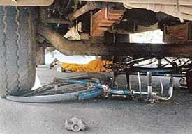 The body and the cycle of the accident victim, Shushma, lying under the bus near the Sector 20 gurudwra roundabout in Chandigarh on Thursday