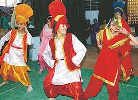 Students of St Joseph Senior Secondary School perform a dance item on the occasion of Baisakhi in Chandigarh