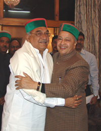 Haryana Chief Minister Bhupinder Singh Hooda and Himachal Pradesh Chief Minister embrace each other after a meeting in Shimla