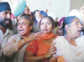 Victims of the 1984 riots protest outside the Mini Secretariat in Ludhiana on Thursday