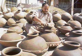 A potter in Patiala busy making pots for the summer