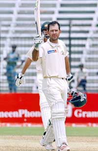 Australias Ricky Ponting raises his bat after scoring a century on the fifth day of the first Test against Bangladesh at the Osmani Stadium in Fatullah on Thursday