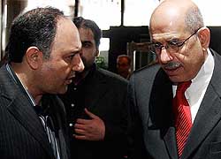 Head of IAEA Mohamed ElBaradei leaves the Azadi hotel with the deputy head of Irans Atomic Energy Organisation Mohammad Saeedi for meetings with Iranian officials in Teheran on Thursday