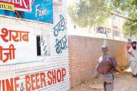 A window of a liquor shop illegally opens towards the main road in the Sector 20 D rehri market.