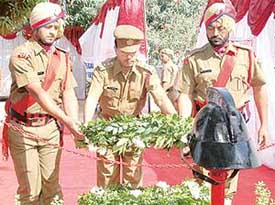 Station fire officer M.L. Sharma lays a wreath to commemorate Martyrs’ Day at the Sector 17 fire station in Chandigarh on Friday.