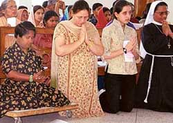 Devotees pray in a church on the occasion of Good Friday in Chandigarh. 