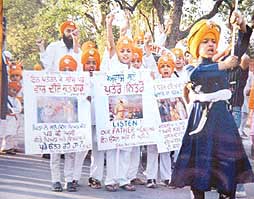 Young Preachers of Faith at a nagar kirtan procession taken out in Patiala on the birth anniversary of Khalsa, The Pure.