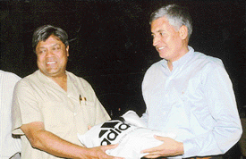 Dr C.K. Jerath (left) being honoured by the chairman of the Chandigarh Amateur Boxing Association, Satish Chandra, at a function at Chandigarh Club on Friday.