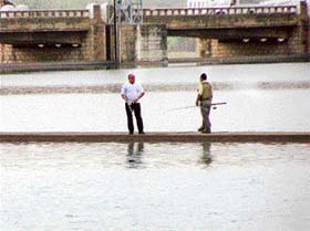 The Governor of Punjab, Gen S.F. Rodrigues, tries to catch a fish from the Sutlej near Ropar