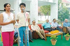 Two children sing a song at the get-together of the J&K Dogra Sabha, Chandigarh