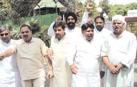 Congress MLAs led by Mukesh Sharma, shouting slogans after giving a memorandum to Delhi Chief Minister Sheila Dikshit at her residence in the Capital