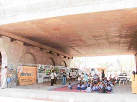 A school for slum children working under a flyover, near the bus stand, in Ludhiana