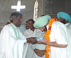 Bishop Ram Lal, chairman, Kalvari Church Trust, presents a copy of the Bible to Capt Amarinder Singh, Chief Minister, Punjab, on Easter in Ludhiana on Sunday.