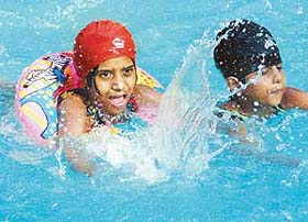 Children enjoy the watery blues in one of the pools in Chandigarh