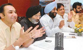Office-bearers of the Punjab Colonisers and Builders Association address a press conference in Chandigarh
