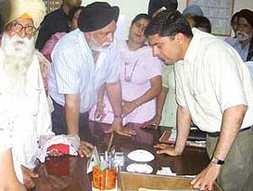 Mr Tejveer Singh, Deputy Commissioner, Mohali, listens to complaints of people in the city