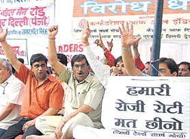 Traders under the banner of Confederation of All India Traders sitting on five days protest dharna against sealing of their shops by MCD, at Jantar Mantar in the Capital on Monday.