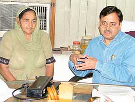 Dr Manoj Sobti with patient Harbhajan Kaur addresses a news conference in Ludhiana on Monday.