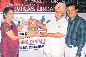 Dr Bhagwant Singh being felicitated at the CDE programme organised by the IDA in Ludhiana on Sunday.