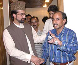 Chairman of Hurriyat Conference Mirwaiz Umar Farooq interacts with members of Kashmiri Pandit Migrant Coordination Committee in Jammu on Tuesday. 