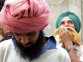 Gurpreet Singh along with his kin mourn the death of his father, Guradita Singh, at Kot Shamir village in Bathinda district on Tuesday.