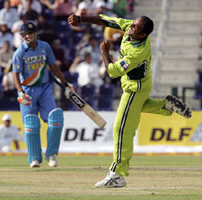 Pakistans Rana Naved-ul-Hasan celebrates Rahul Dravids run out during the first one-day international Cricket between India and Pakistan at the Zayad Cricket Stadium in Abu Dhabi 